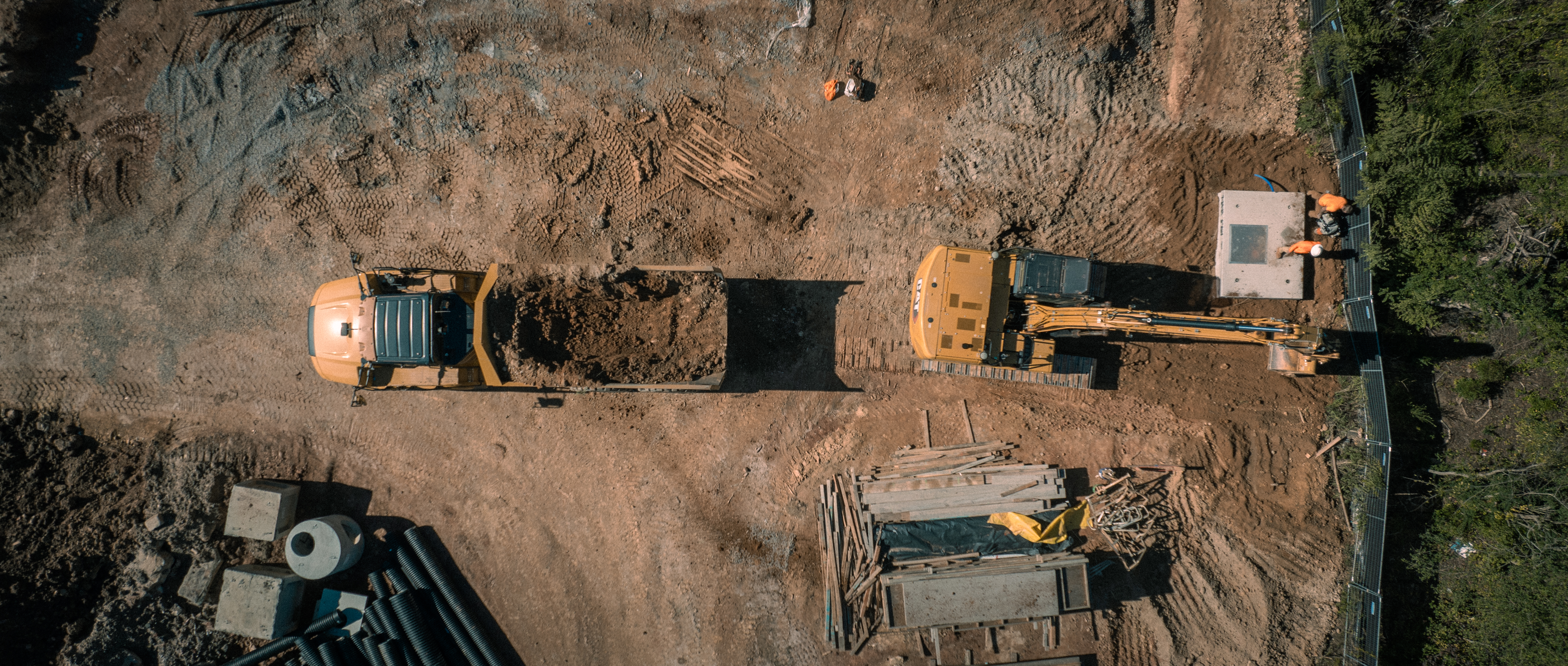 Excavator and dump truck at Pendleton Mills